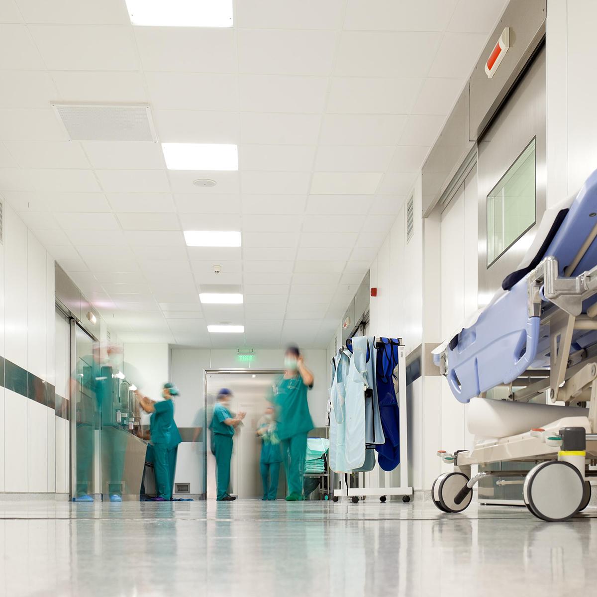 Slightly out of focus photo of a busy hospital corridor